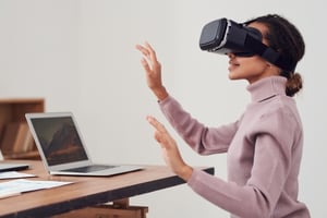 A woman using virtual reality goggles.