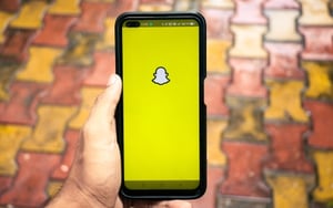 A phone with Snapchat on it.