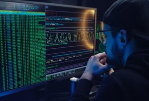 A man looking at a computer.