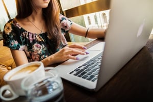 A woman on a computer.