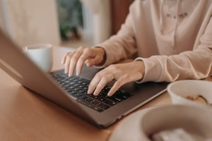 A person typing on a computer.