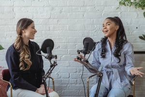 Two women on a podcast.