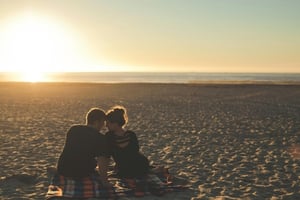 A couple at a beach.