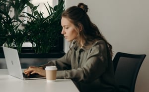 A woman on a computer.