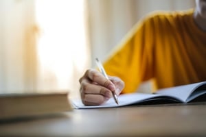 A person writing a new story.