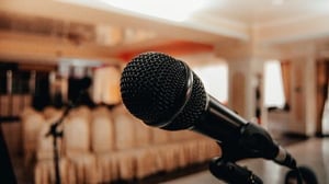 A microphone on a podium for a speaking engagement.