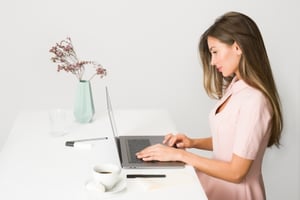 A woman on a computer.