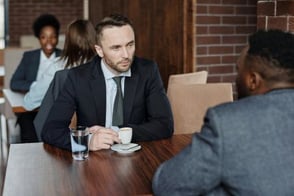 A PR pro meeting with a jouranalist.